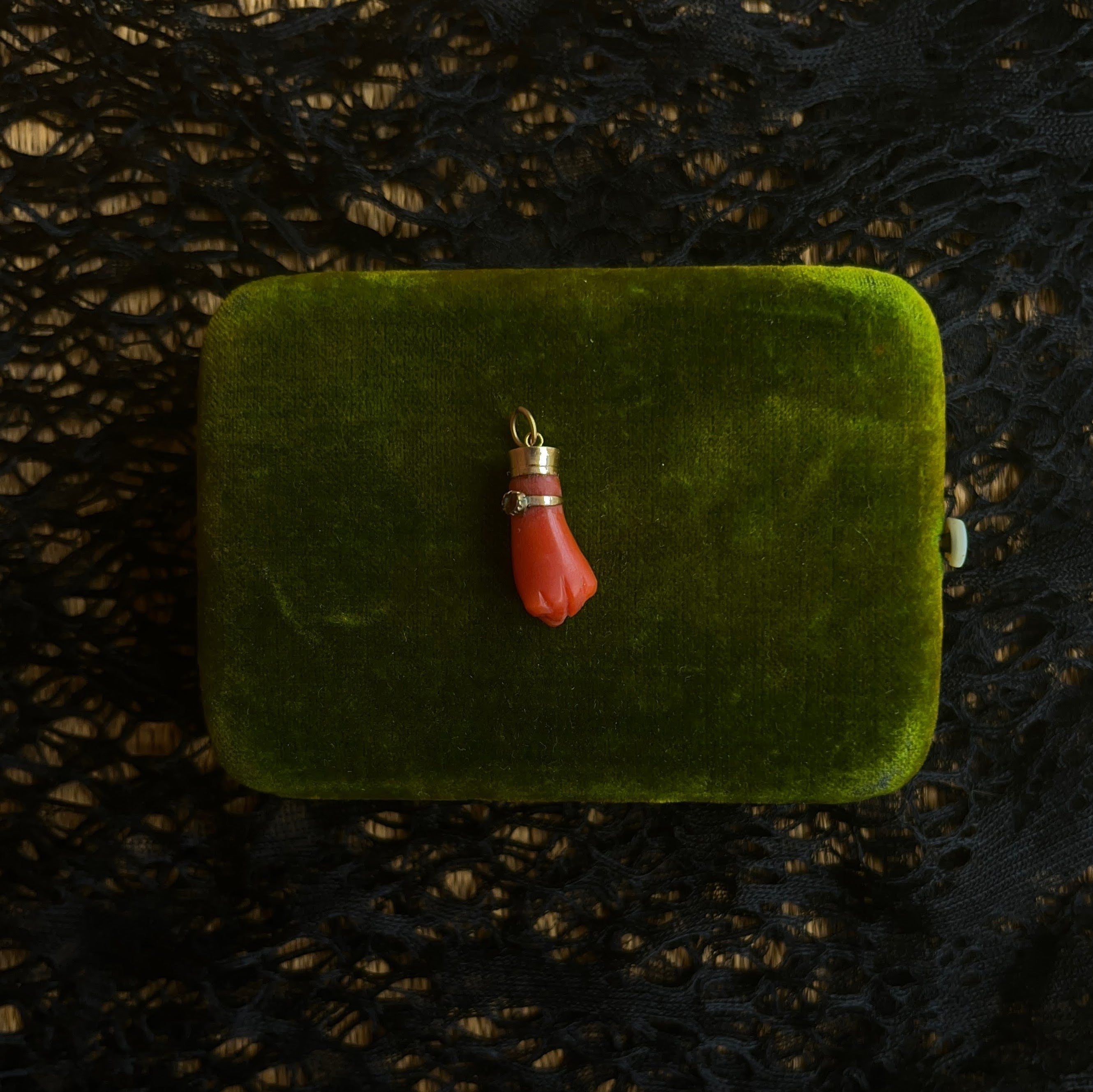 19th c. Carved Coral Fist Pendant | As Is